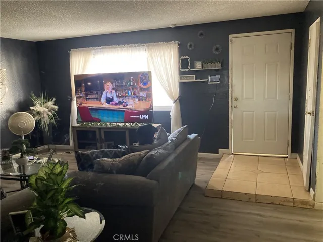 Unit A - Living room showing entry door