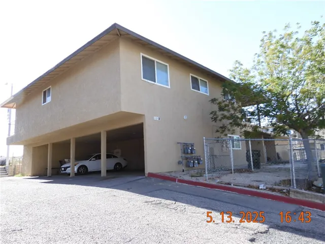 4 Carports on south side.  Photo also shows the back yards on east side of unit