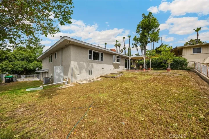 Back yard toward house and stables (in the rear)