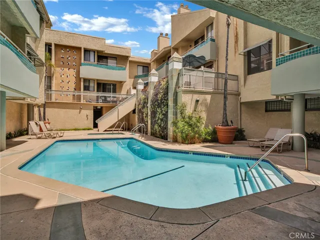 Community courtyard featuring refreshing pool at the center