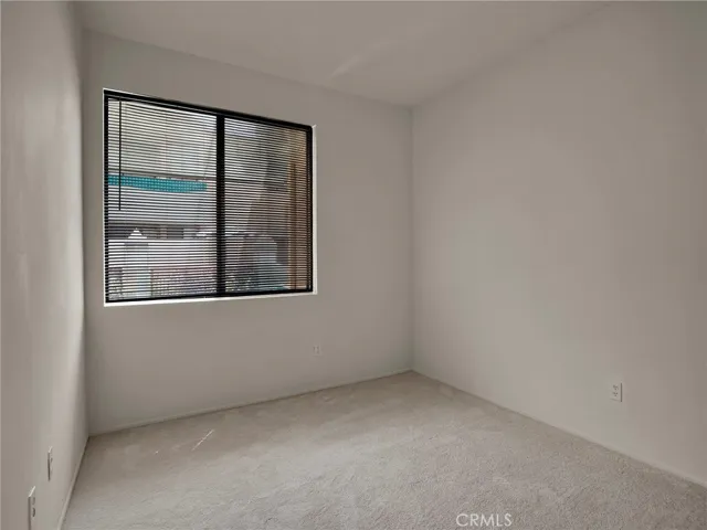 Master bedroom window overlooking the pool spa and courtyard