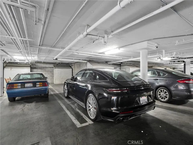 Secure, gated parking with tandem two car spaces and private storage shed, conveniently located near the unit