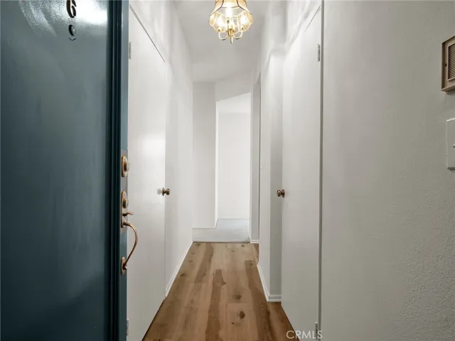 Entry hallway offering convenient access to closets, kitchen and main living areas.