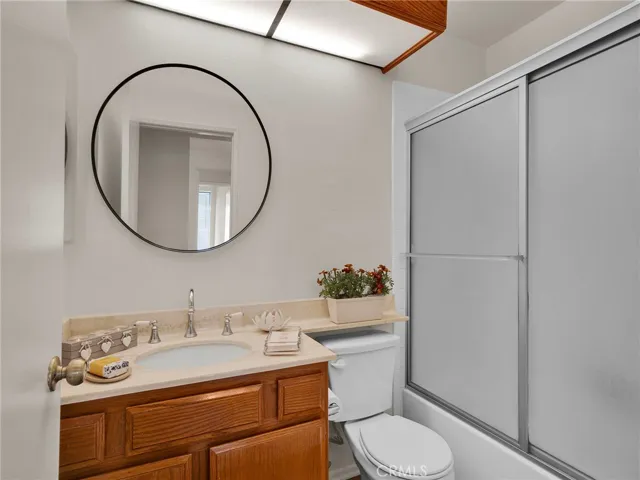 Hallway bathroom featuring a shower over tub combination.