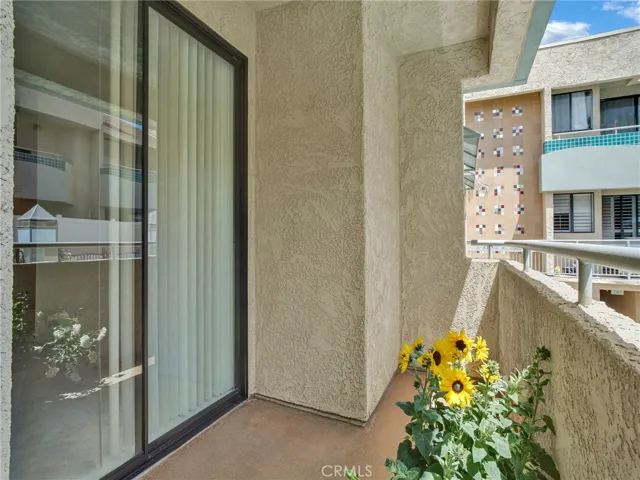 Enjoy a private patio space with a railing and easy access to the living room.