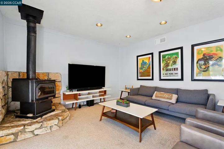 Wood Burning Stove and Sliding Door Leading to Backyard from this room.