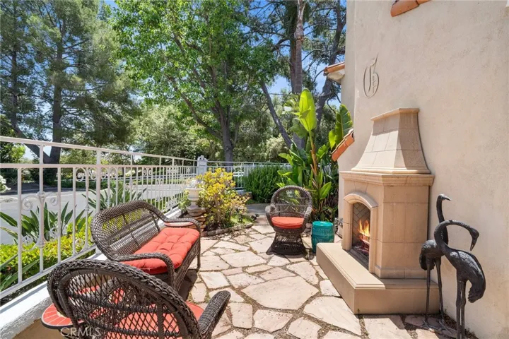 Side area patio with fireplace is a great spot for cocktails and lounging.