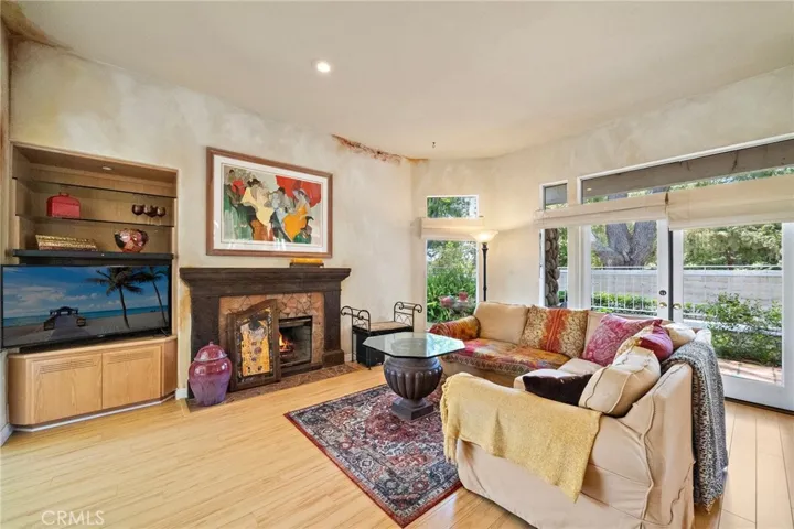 Great room with fireplace and French doors to rear patio.