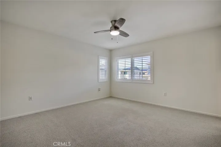 Master Bedroom With View Of Community Pool