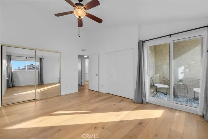 Primary bedroom with private balcony