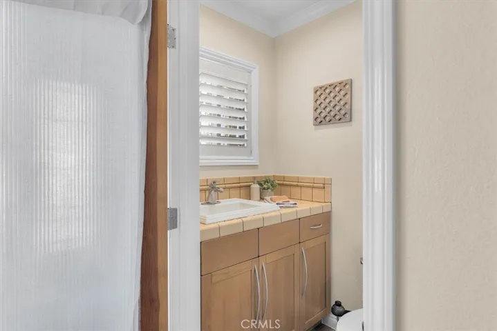 Main floor powder room off the entry