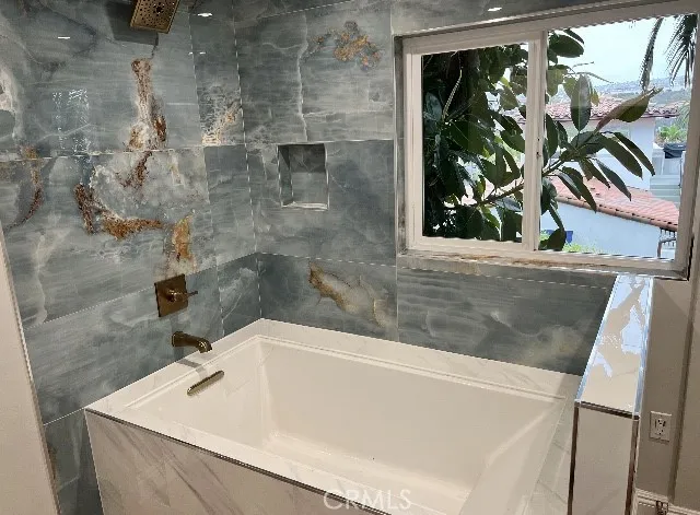 Relax in this custom oversized tub/shower
