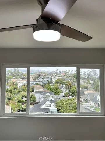 Second large bedroom with views of green mature trees, cool breeze, new ceiling fan