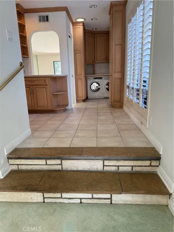 Steps from den to laundry and kitchen