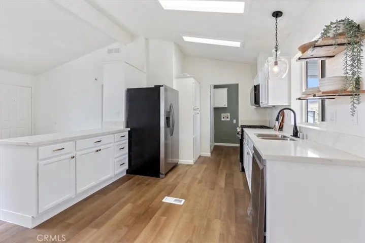 Entry with new flooring thru out and new kitchen cabinets and appliances