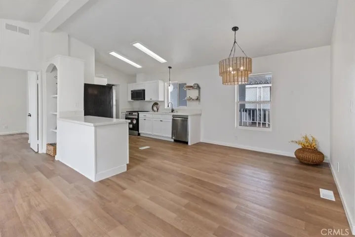 Entry with new flooring thru out and new kitchen cabinets and appliances