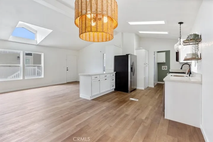 Entry with new flooring thru out and new kitchen cabinets and appliances