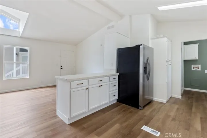 Entry with new flooring thru out and new kitchen cabinets and appliances