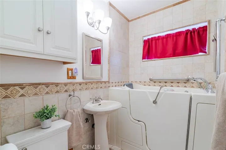 Front bathroom includes walk-in bathtub