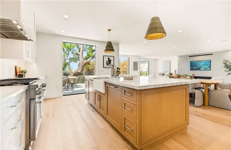 EXPANSIVE GREAT ROOM W/LA CANTINA POCKET DOORS CREATES SEAMLESS INDOOR/OUTDOOR LIVING