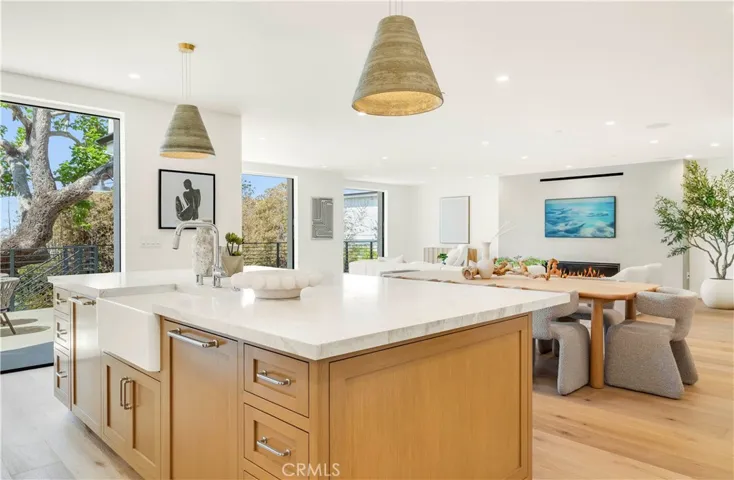 OVERSIZED ISLAND WITH FARM SINK IS A COMMAND POST FOR LIVING