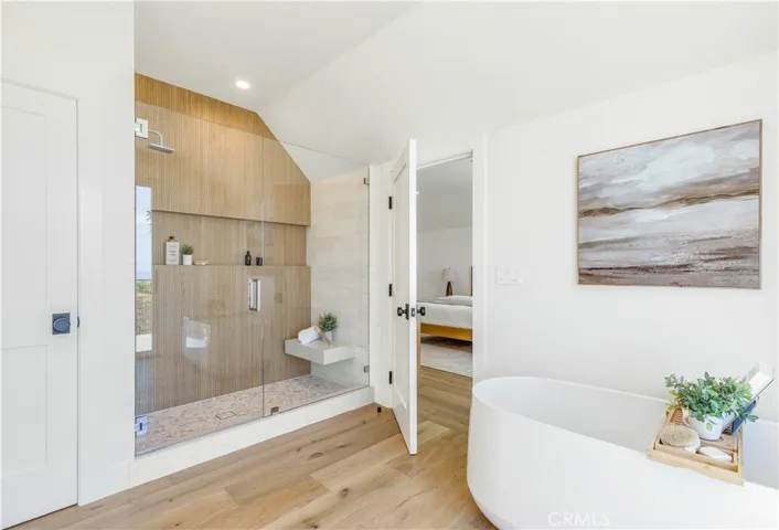 PRIMARY BATH WITH OVERSIZED SHOWER AND FREESTANDING TUB