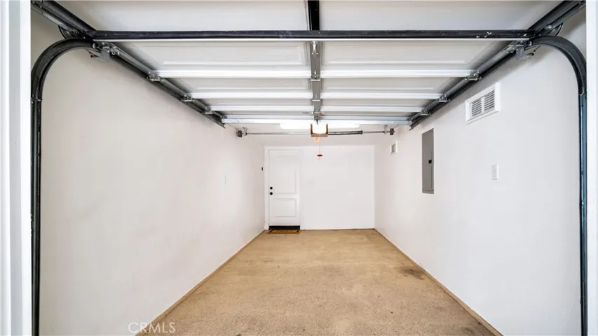 Garage is tandem, one inside and one covered.
