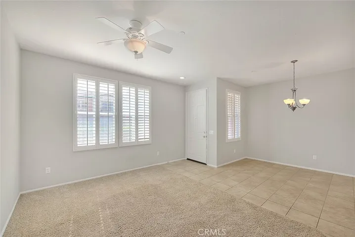 Entry to living and dining space of the condo