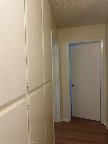 Hallway with lots of Cabinet Space