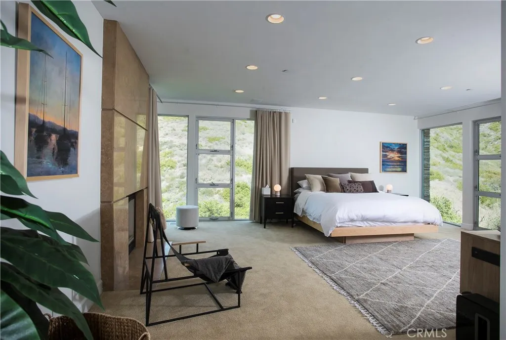 SPACIOUS MASTER BEDROOM WITH FIREPLACE AND DOUBLE WALKIN CLOSETS