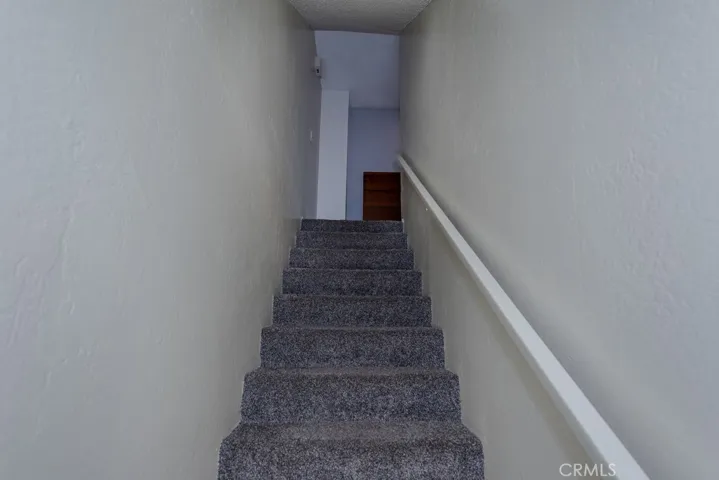 View of the stairs to bonus room