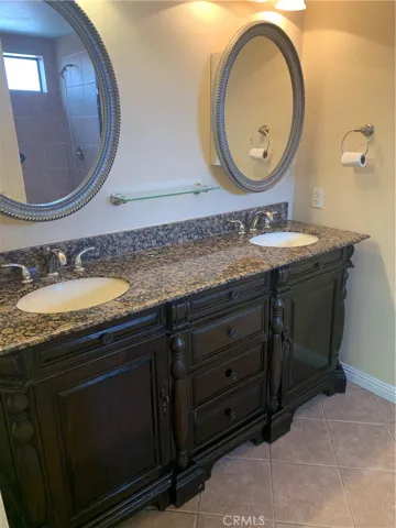 Master suite bath dbl vanity with cabinets in mirrors