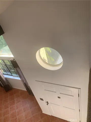 Natural light in foyer with decorative window
