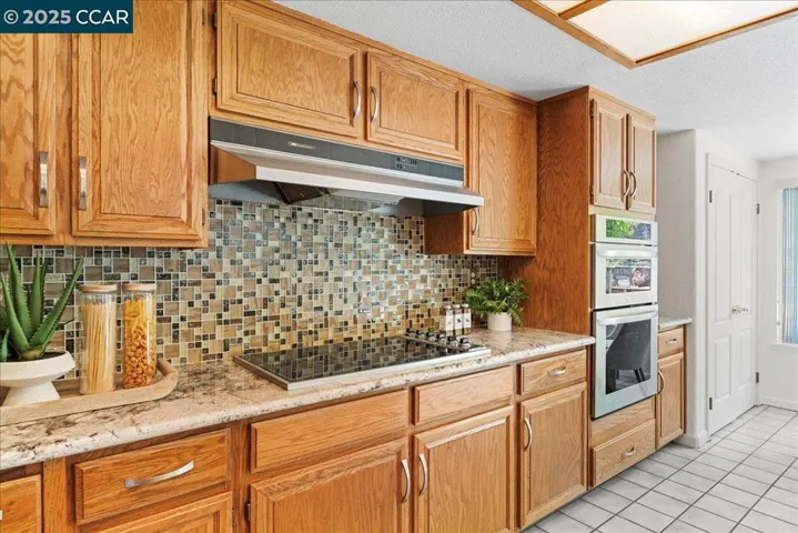 Granite countertops and custom tile backsplash