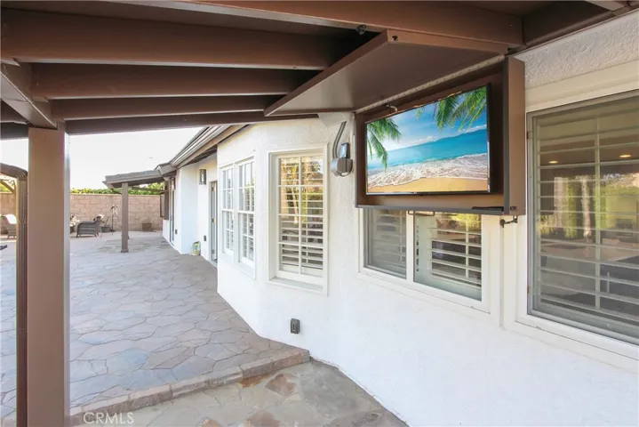 Outdoor TVs with protective fold-up cabinets