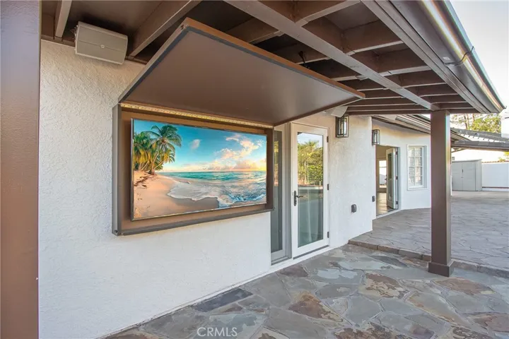 Outdoor TVs with protective fold-up cabinets