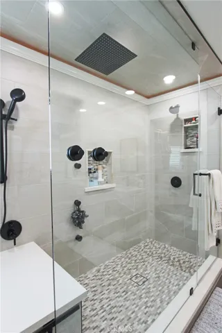 Primary bathroom with multiple valves shower head system