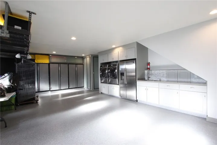 Bulky item storage cabinet keeps bikes or sporting gear out of​​‌​​​​‌​​‌‌​​‌​​​‌‌​​​‌​​‌‌​​‌‌​​‌‌​​​​ sight
