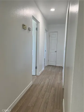 Hallway to three bedrooms