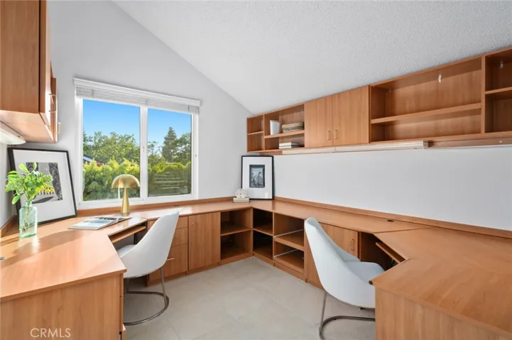 Stunning built-ins provide endless storage to this light & bright room~ also appreciate high ceilings & refreshing views