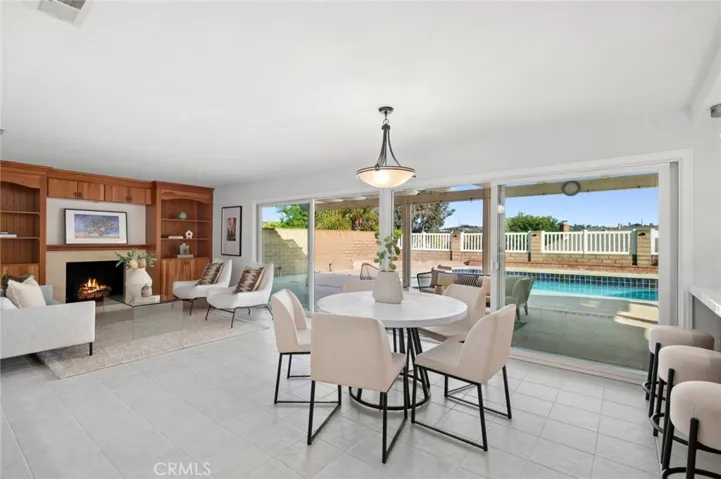 Appreciate large sliders providing beautiful views of your glistening pool