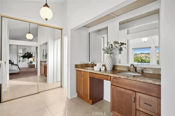 Granite Double vanity & mirrored closet doors are always a must.