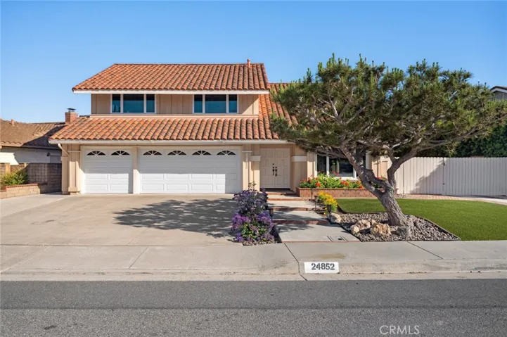 Replaced tilt-up garage doors, newer front yard turf present incredible curb appeal