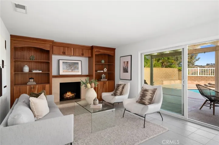 Classic built-ins surround the marble fireplace