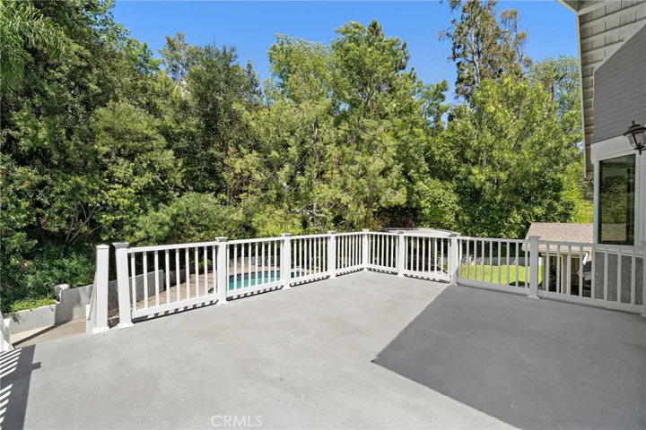 Primary bedroom deck overlooking backyard