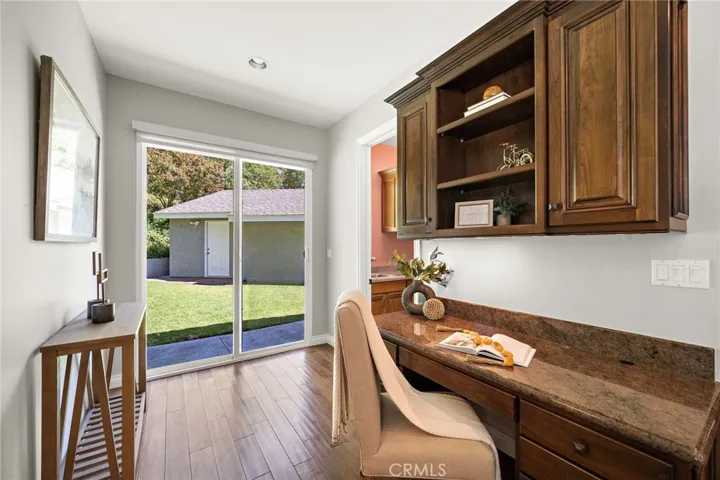 Work space off of kitchen with slider to backyard