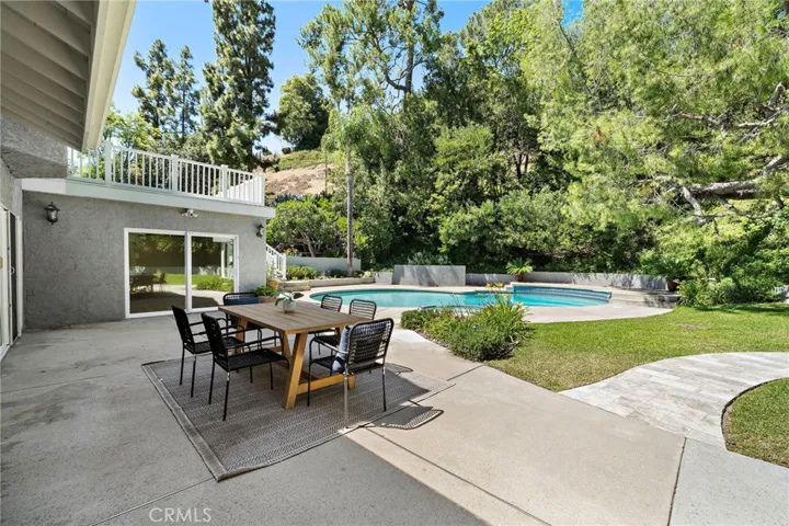 Plenty of patio space with the slider doors leading to the pool/activity room and bathroom - great for extra fun and activities like a pool table, games or workout space.