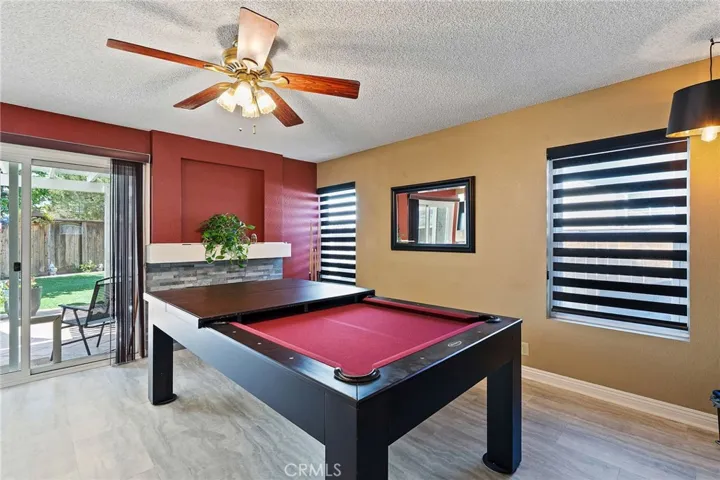 Family room with pool table that can turn inti a dinning table.