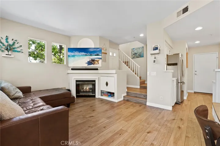 Great size family room with fireplace and direct access to the large outdoor living area.