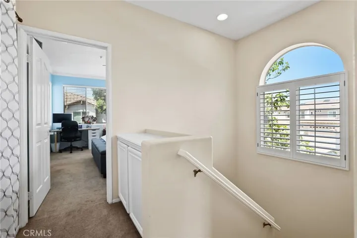 Upstairs hallway with laundry closet.